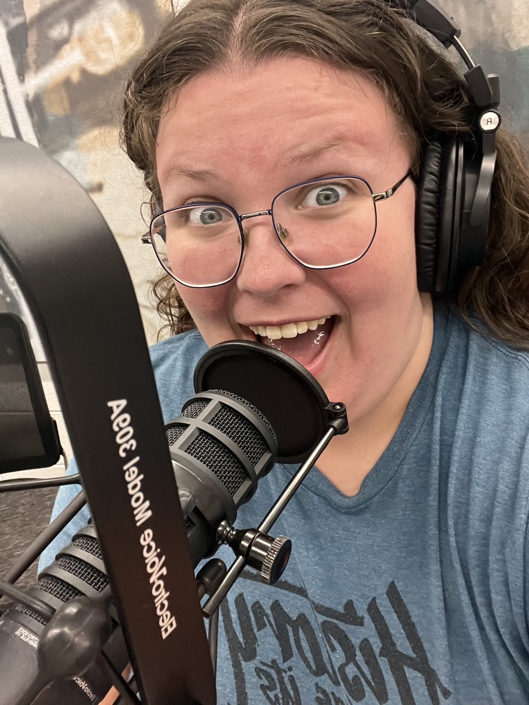 Kailee in the RGBX Studio with the microphone.